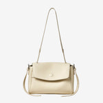 Cuirae ivory pebbled top-grain leather flap shoulder and crossbody bag, front view