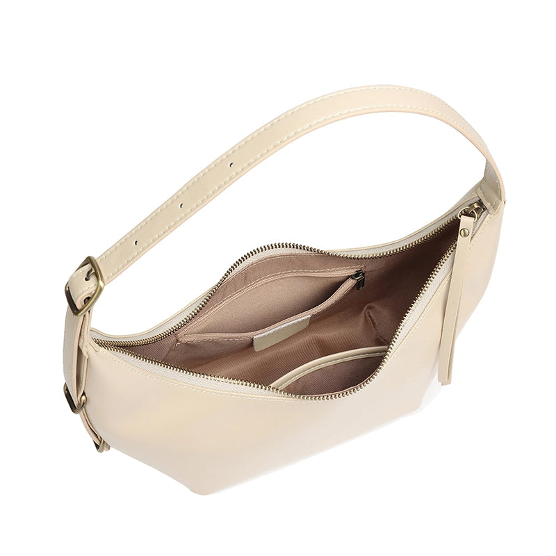 Inside view of the Cuirae leather handbag showing the zip and slip pockets.