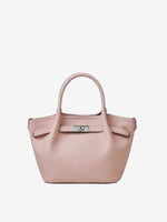 Cuirae light pink pebbled genuine leather kelly crossbody bag with silver turnlock hardware, front view on white background