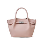 Cuirae light pink pebbled genuine leather kelly crossbody bag with silver turnlock hardware, front view on white background
