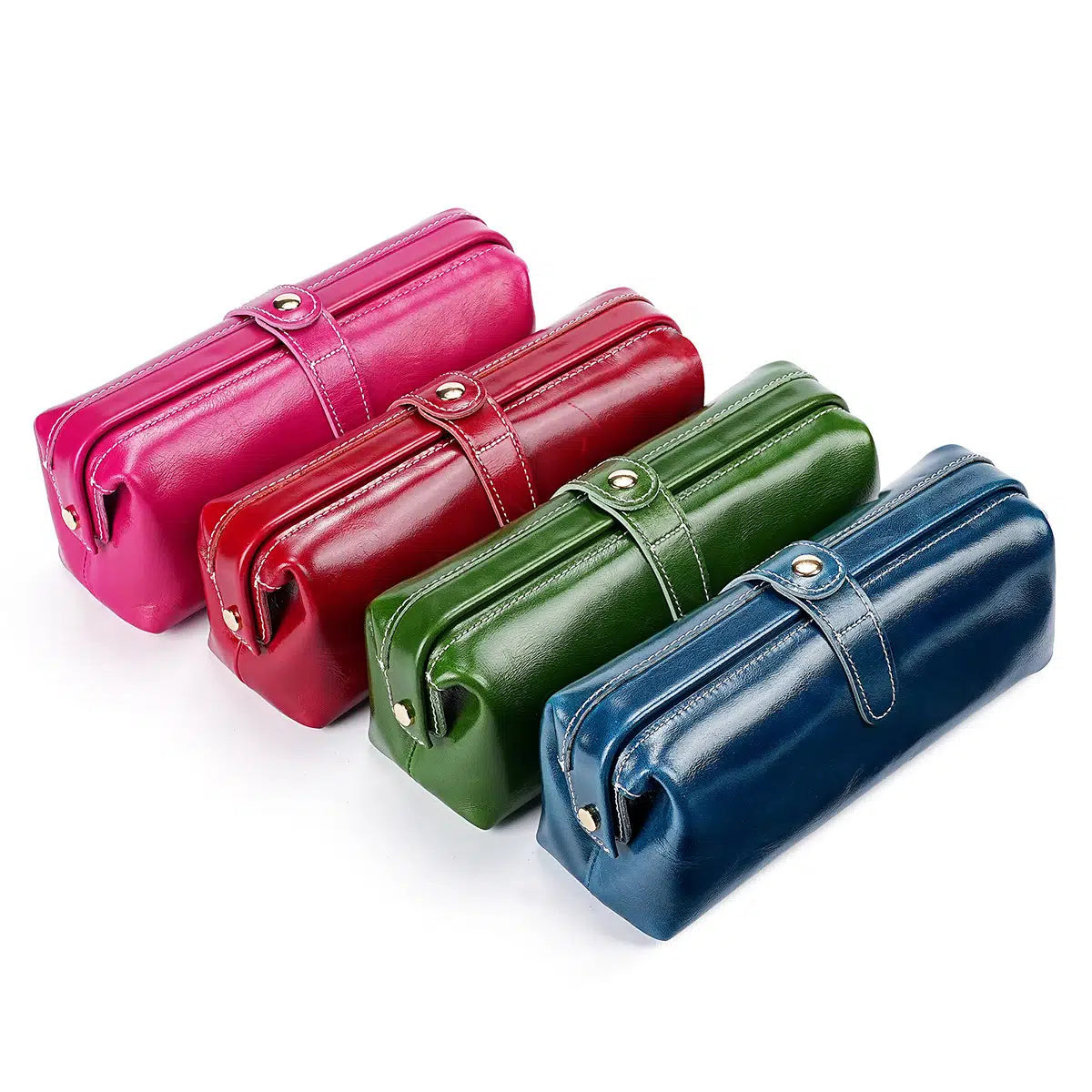 Four Cuirae genuine leather makeup bags in purple, red, green, and blue arranged in a diagonal row on a white background.