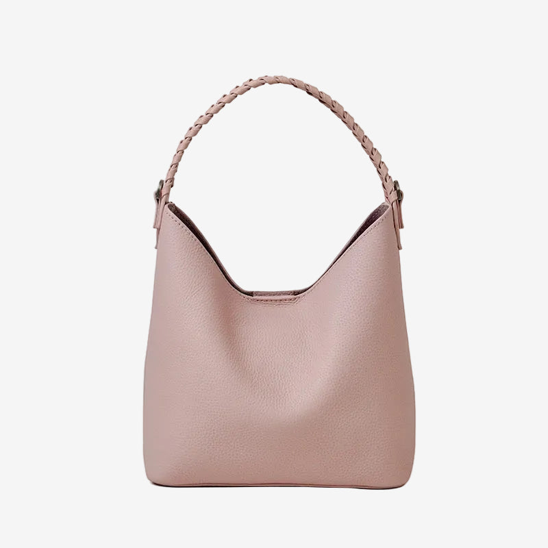 Cuirae pink pebbled genuine leather bucket bag with black braided top handle, front view on white background