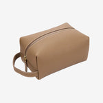 Cuirae stone pebbled genuine leather makeup bag with gold zipper and wrist strap, front angled view on white background