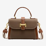 Cuirae taupe and brown genuine leather shoulder  bag with a wide canvas strap, front view, plain white background
