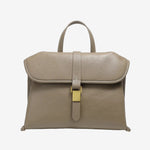 Cuirae taupe genuine leather flap handbag with gold buckle and contrast stitching, front view on white background