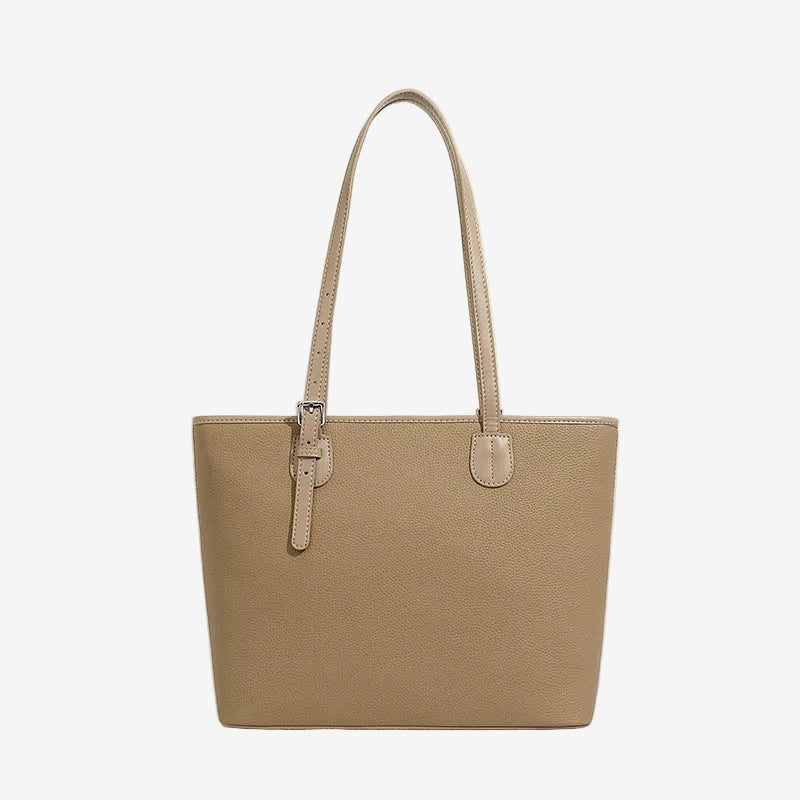 A front view of the Cuirae taupe genuine leather tote bag standing on a plain background.