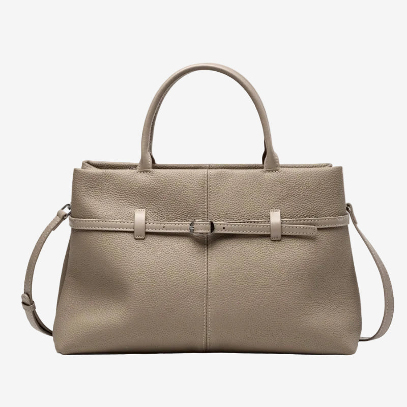 Cuirae taupe pebbled genuine leather handbag with belt buckle detail and silver hardware, front view on white background
