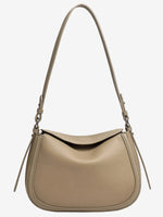 Taupe Cuirae pebbled leather shoulder bag with an adjustable strap, front view