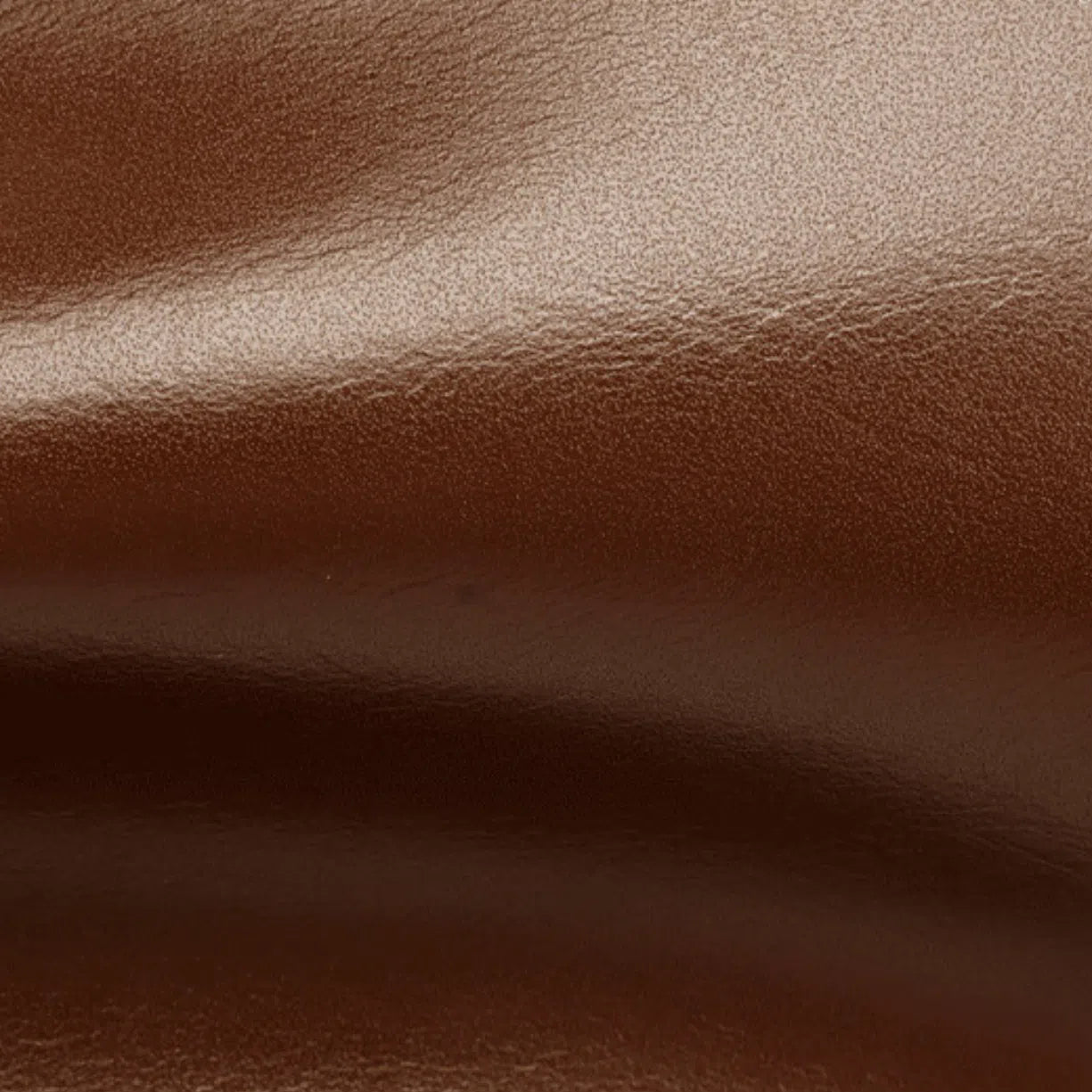 Close up of the soft, tear-resistant top grain cowhide used on Cuirae genuine leather bags