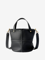Black top-grain leather bucket bag with raised cross seams, twin handles, and gold-tone hardware