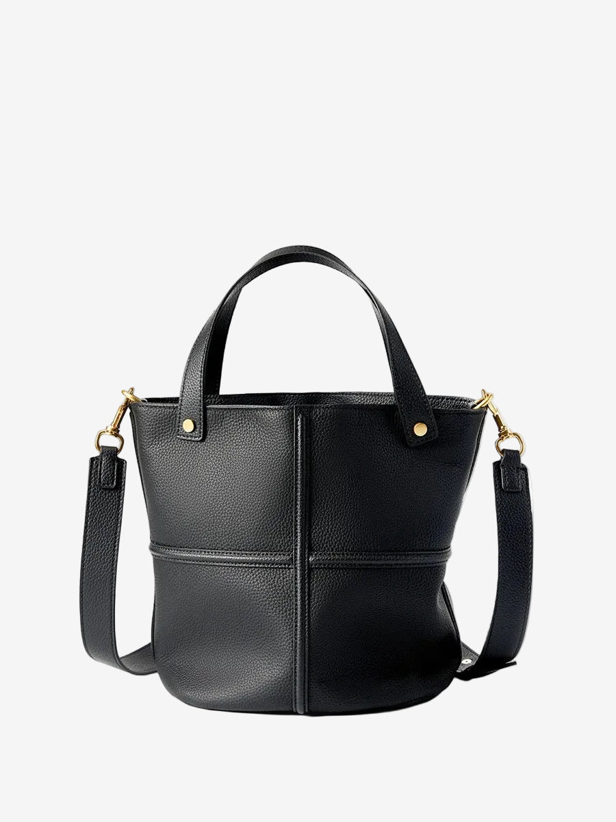 Black top-grain leather bucket bag with raised cross seams, twin handles, and gold-tone hardware