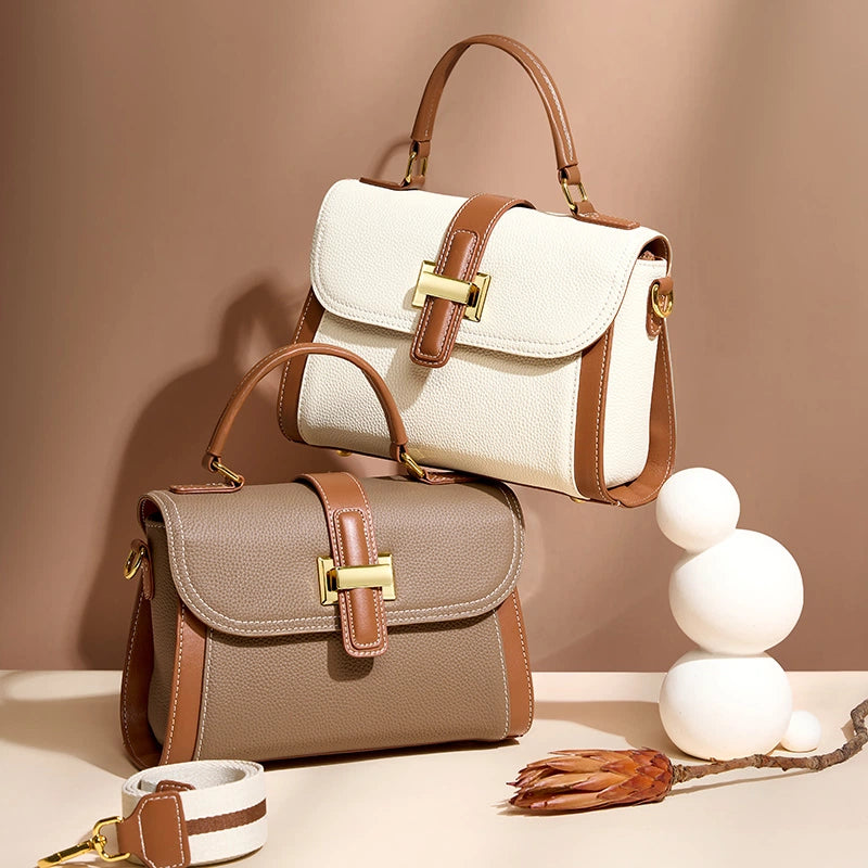 Two Cuirae genuine leather shoulder bags in white and brown two-tone colors displayed on a table.