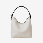 Cuirae white pebbled genuine leather bucket bag with black braided top handle, front view on white background