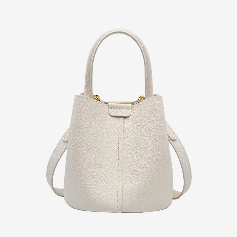 Cuirae white pebbled genuine leather bucket bag with top handle and detachable strap, front view on white background