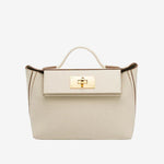 Cuirae white pebbled genuine leather flap kelly crossbody bag with gold turnlock hardware, front view on white background
