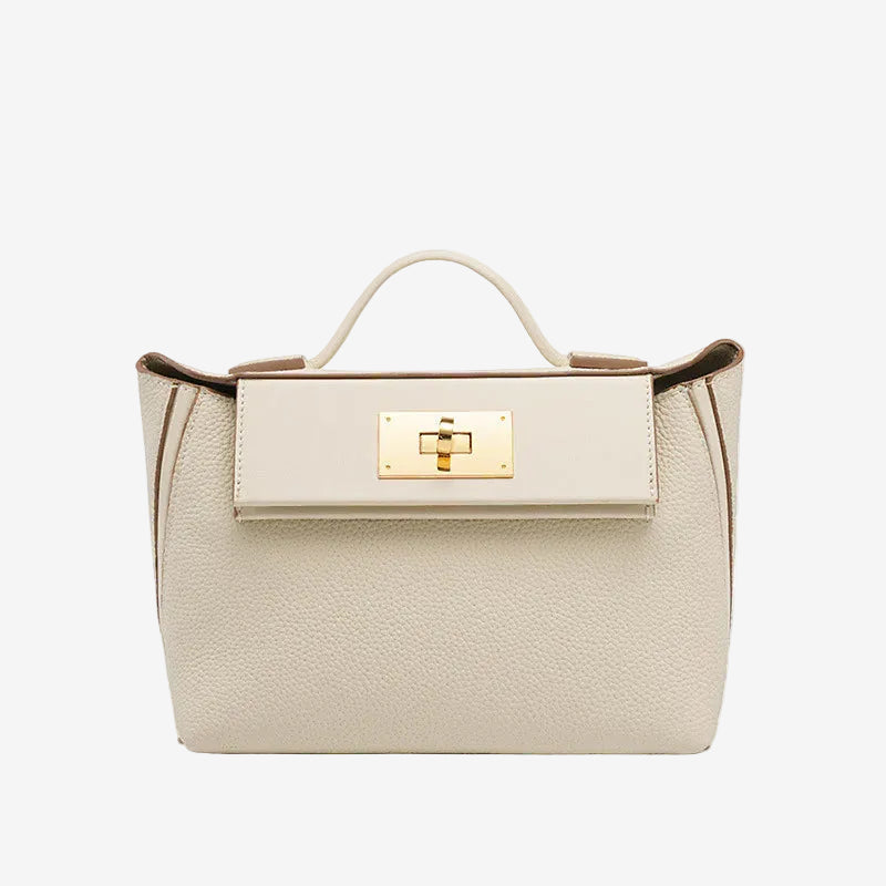 Cuirae white pebbled genuine leather flap kelly crossbody bag with gold turnlock hardware, front view on white background
