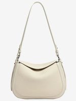 White Cuirae pebbled leather shoulder bag with an adjustable strap, front viewWhite