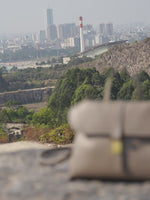 A dynamic showcase of the Cuirae genuine leather handbag, highlighting its appearance up close and the details and metal hardware, as well as how the models demonstrate its versatility with various outfits.