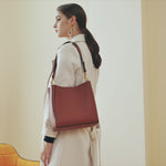 A dynamic showcase of the Cuirae genuine leather bucket bag, highlighting its appearance up close and the details, as well as how the models demonstrate its versatility with various outfits.