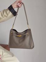 A dynamic showcase of the Cuirae genuine leather crossbody bag, highlighting its appearance up close and the details and capacity, as well as how the models demonstrate its versatility with various outfits.