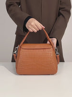 A dynamic showcase of the Cuirae genuine leather crossbody bag, highlighting its spacious interior, built-in pockets, and metal hardware details, as well as how the models demonstrate its versatility with various outfits.
