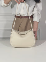 Cuirae pebbled leather shoulder bag video showing its adjustable strap, zippered compartments, and shoulder and crossbody wear.