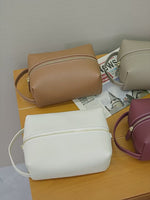 A dynamic showcase of the Cuirae genuine leather makeup bag，close-up shots of the various colored makeup bags; individual shots of the beige storage bag, showing its exterior, interior space, and details of the inner pockets.