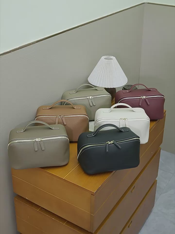 A dynamic showcase of the Cuirae genuine leather makeup bag，close-up shots of the various colored makeup bags; individual shots of the black storage bag, showing its exterior, interior space, and details of the inner pockets.